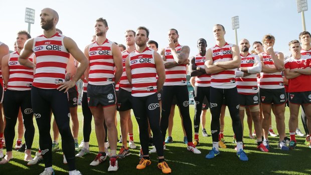 Show of unity: Sydney players stand in solidarity for teammate Adam Goodes.