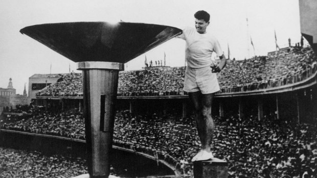  Australian Olympian Rob Clarke lights the Olympic Torch at the opening ceremony of the 17th Olympic Games held in Melbourne, 1956. 