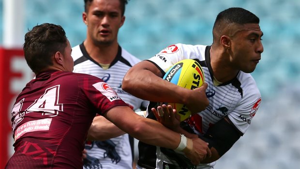 Speedster: Robert Jennings tries to evade the Manly defence.
