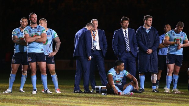 Hard to swallow: Blues coach Laurie Daley and his team after losing game three.