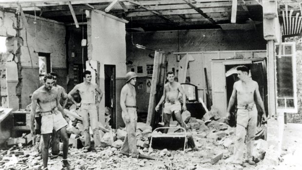 A house is destroyed after being hit by a Japanese bomb during an attack on Darwin in 1942. 
