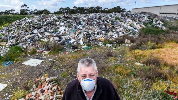 Bill Patten on land he leased to a Melbourne company he says dumped asbestos-riddled rubbish and walked away. 