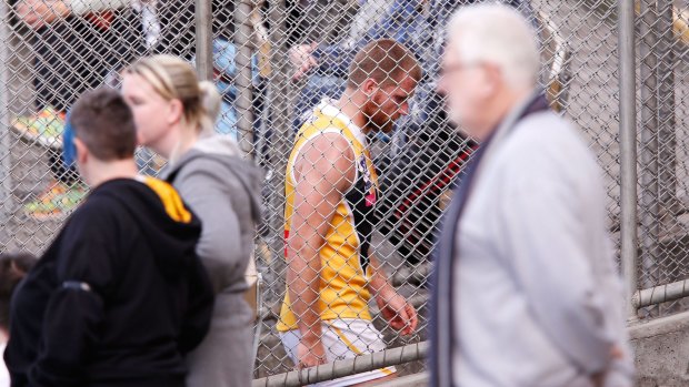 Leigh Adams heads to the rooms after receiving a head knock while playing for Werribee on Sunday.