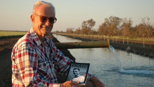 Paul Kahl with his autobiography, <i>Cotton Pickin' Pioneer</i> (2006), at one of his Wee Waa district properties.