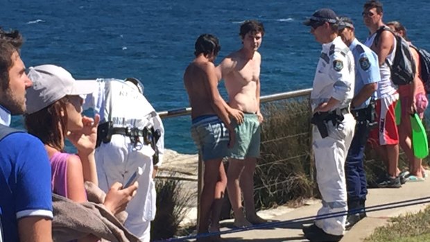 Police with the teenagers rescued from the cliffs between Bondi and Tamarama. 