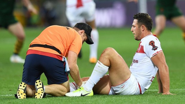 Casualty: Sam Burgess is treated for a knee injury that may leave him on the sidelines for three to four weeks.