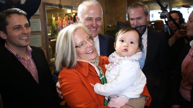 Lucy Turnbull hugs her granddaughter Isla as Prime Minister Malcolm Turnbull and son Alex look on. 