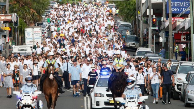 Huge crowds turn out for the White Ribbon Walk at Coogee on Tuesday morning. 