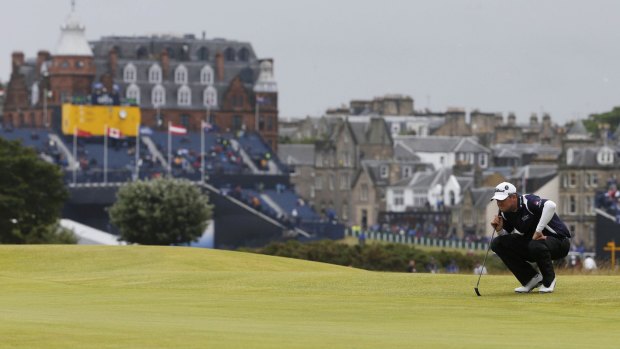 Australian Marc Leishman lines up his putt on the 16th green during the third round of the British Open golf championship on the Old Course in St. Andrews on Sunday.