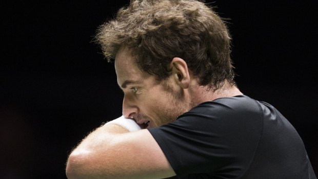 Andy Murray feels the pain after losing to Gilles Simon in Rotterdam.
