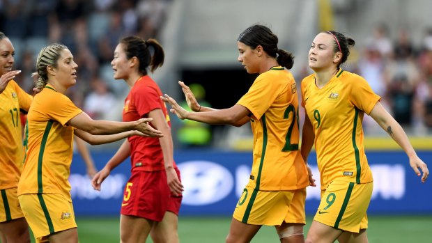 Sam Kerr celebrates after putting the Matildas 3-1 up against China at Skilled Stadium in Geelong.