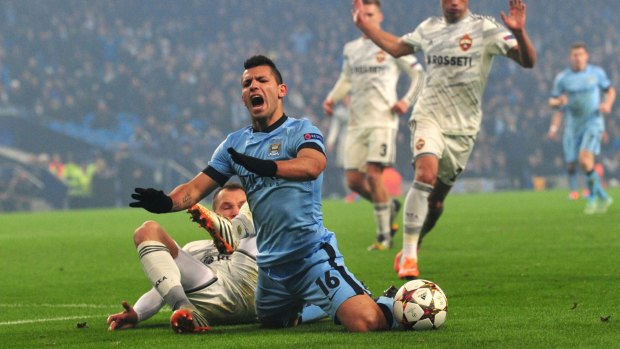Manchester City's Sergio Aguero (centre) is challenged by CSKA Moscow's defender Sergei Ignashevich before he was shown a yellow card for diving during the Champions League match on Wednesday.