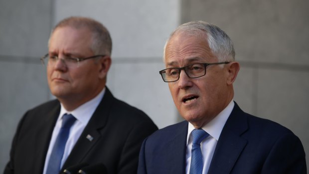 Prime Minister Malcolm Turnbull and Treasurer Scott Morrison announcing the royal commission during a joint press conference at Parliament House on Thursday.