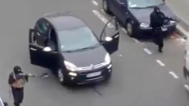 Gunmen outside the Paris offices of Charlie Hebdo. 