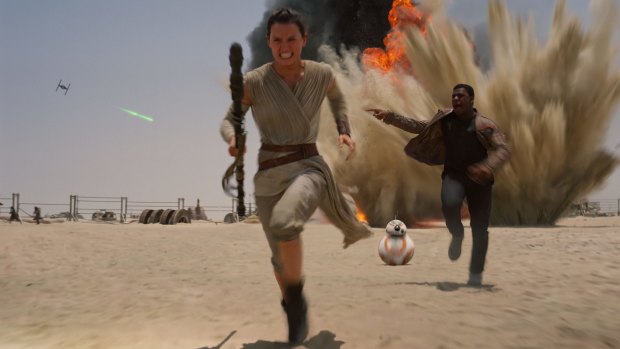 Daisy Ridley  and John Boyega in Star Wars: The Force Awakens.
