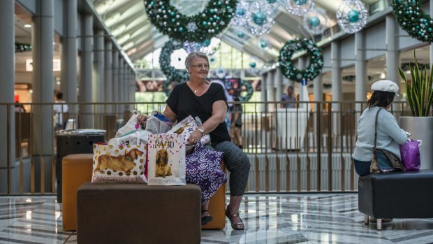 Sue Nelms of Kambah minds her granddaughters' shopping at the Canberra Centre.