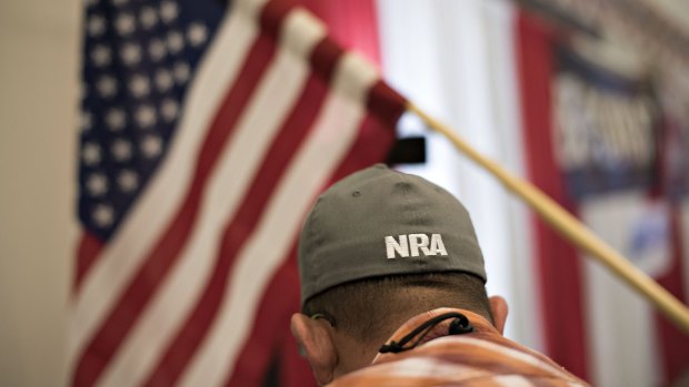 An NRA logo on the hat of a shooting instructor at an air gun range during the NRA convention.