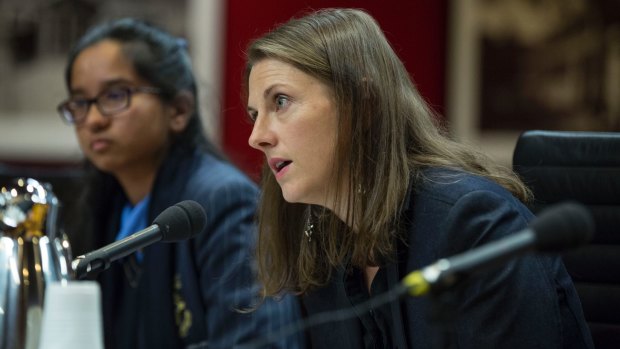 Saffron Howden founder and editor of Crinkling News appears before the Senate inquiry with reporter Diya Mehta, 15.