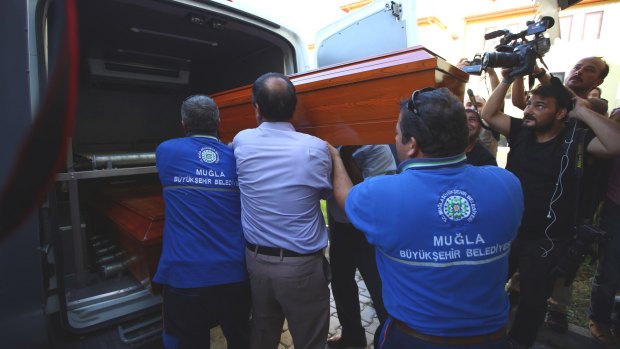 Officials carry the coffin of Rehan Kurdi, the mother of Syrian boys Aylan and Galip from a morgue to a funeral car in Mugla, Turkey.