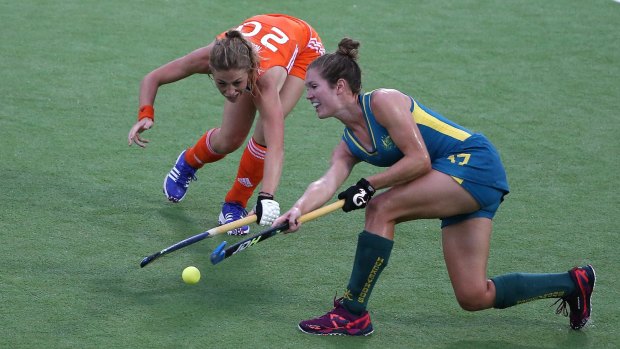 Tough battle: Hockeyroo Georgina Morgan competes with Laura Nunnink of the Netherlands. 