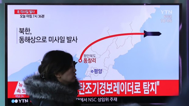 A TV news program reports North Korea's recent missile launch in Seoul, South Korea.