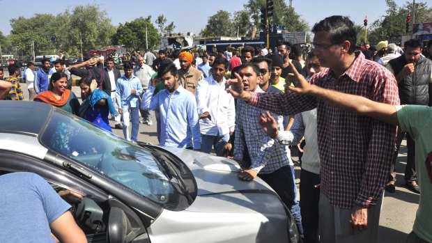 Members of the Jat community block the Chandigarh-Delhi highway on February 21.