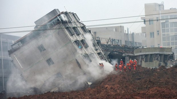 Rescuers search for survivors in a collapsed building following a landslide in Shenzhen, in south China's Guangdong province.
