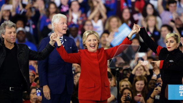 Final stop: Hillary Clinton is joined by Jon Bon Jovi, left, Lady Gaga, right and former President Bill Clinton during a late-night campaign rally at North Carolina State University.