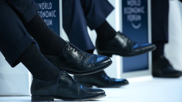 Executive style: speakers during a panel session in Davos, Switzerland, this week. 