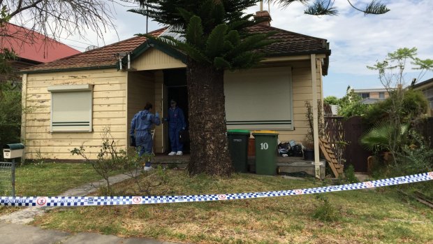 Police search for the body of missing schoolgirl Quanne Diac at a house in Granville on Monday morning.