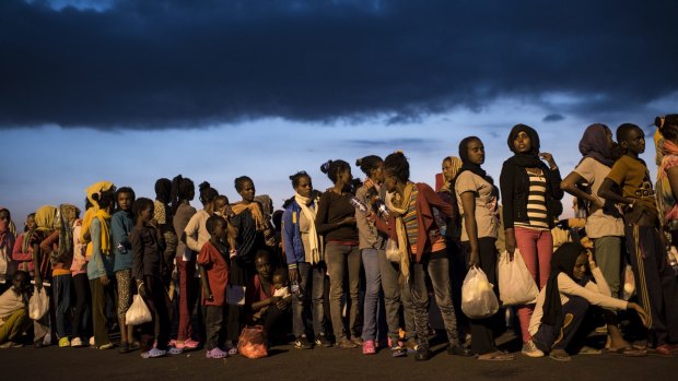 Hundreds of migrants from sub-Saharan Africa arrive at Augusta port in Sicily, Italy.