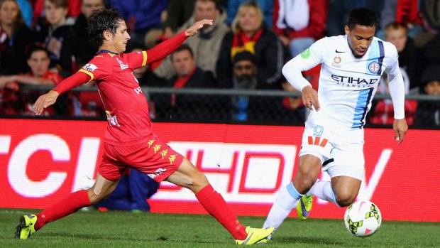 Harry Novillo (right) of Melbourne City competes for the ball with Pablo Snchez Alberto of Adelaide United.