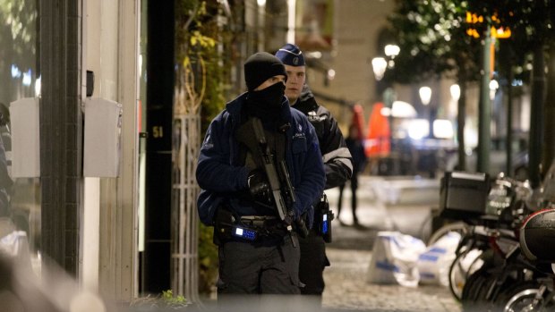 Police patrol the centre of Brussels on Sunday.