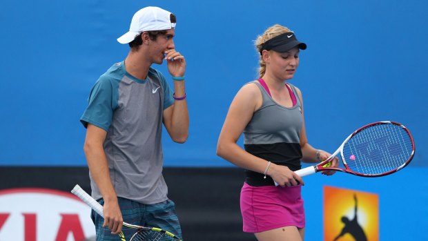 Caught in the middle: Thanasi Kokkinakis and Donna Vekic at the 2014 Australian Open.