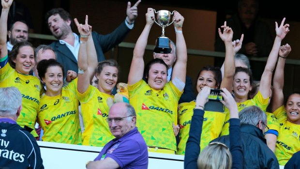 Defying the odds: Australia women's sevens team celebrate their victory at Twickenham.