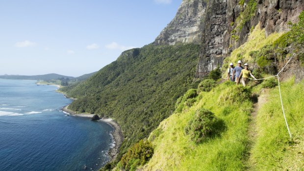 Visitors hike up Mount Gower, Lord Howe Island.
