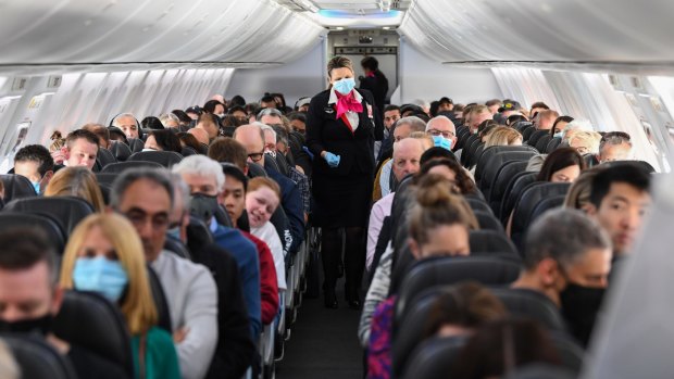 On board the first flight between Sydney and Adelaide after borders reopened last month. South Australia's decision to allow quarantine-free travel from NSW saw Sydney-Adelaide land fourth on the list.