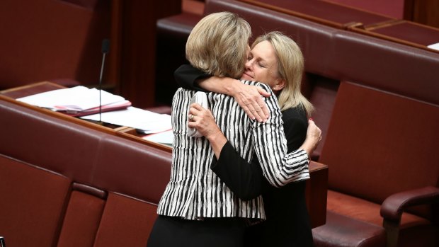 Senator Fiona Nash embraces Senator Michaelia Cash after the Fair Work (Registered Organisations) Amendment Bill 2014 passes the Senate.
