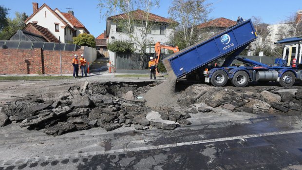 The sinkhole is believed to have been caused by a burst water main.