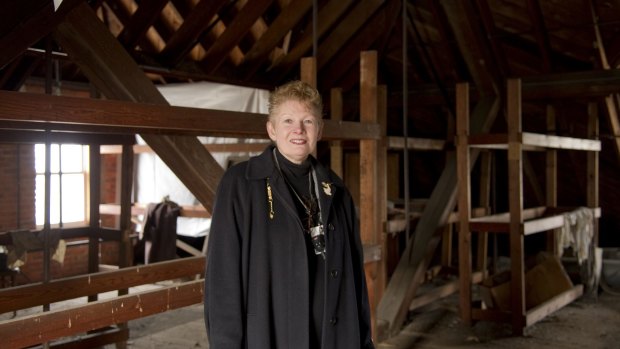 Willard employee Beverly Courtwright and the attic where the suitcases were stored. 