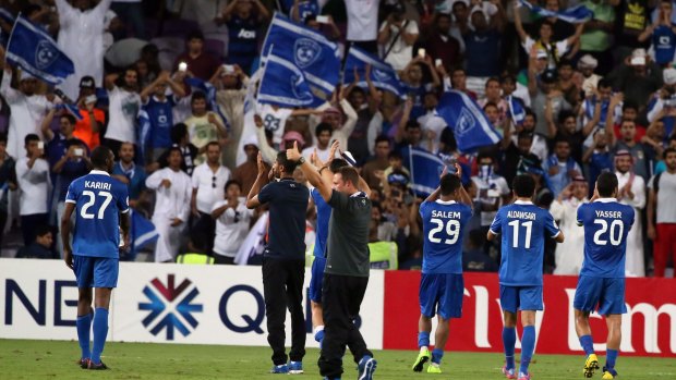 Saudi Al-Hilal players celebrate with their fans after defeating UAE's Al-Ain in the semi-final.