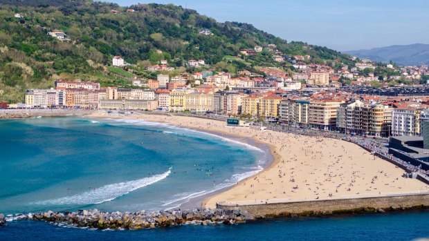 Zurriola Beach, San Sebastian, where you can hang out with friends on the rock wall and enjoy a drink.