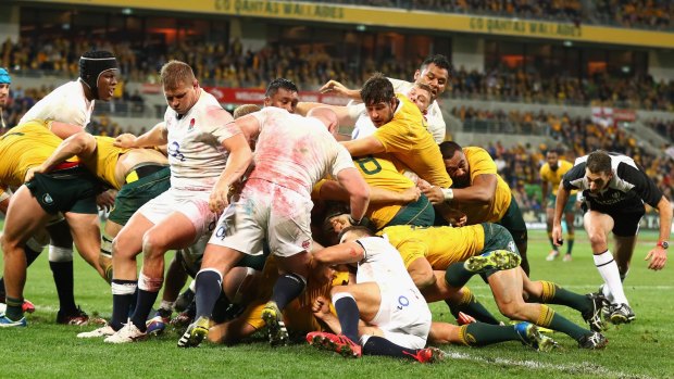 From the front: Wallabies captain Stephen Moore scores in the second Test against England.