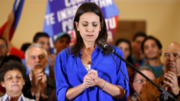Maria Corina Machado, one of three opposition figures recently banned from holding office, speaks in Caracas.