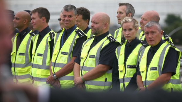 British Border Force officials ahead of a visit by Home Secretary Theresa May and French Interior Minister Bernard Cazeneuve in Calais.