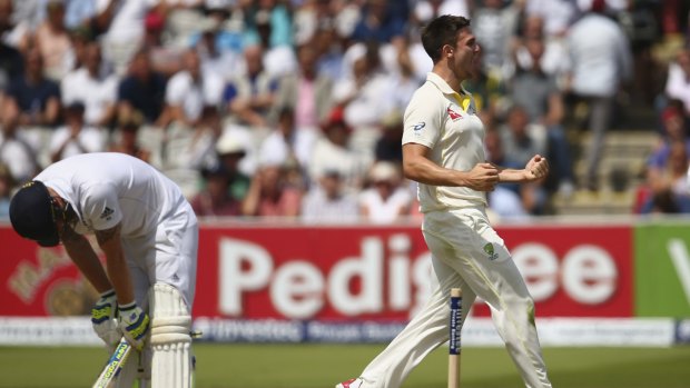 Happy with that: Mitch Marsh celebrates after taking the wicket of Ben Stokes.