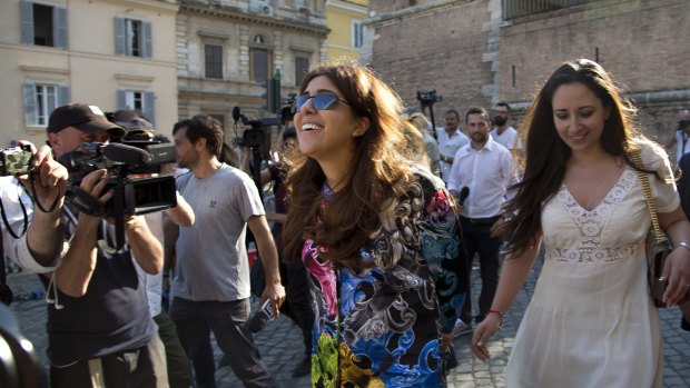 Francesca Chaouqui, centre, flanked by her lawyer Laura Sgro', right, leaves the Vatican on Thursday.