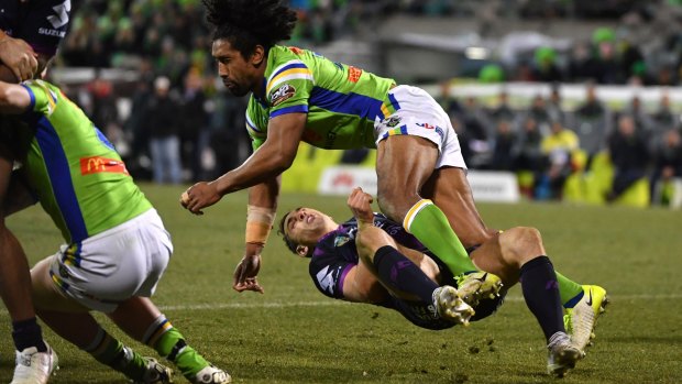 Billy Slater goes to ground after being collected high by Sia Soliola.