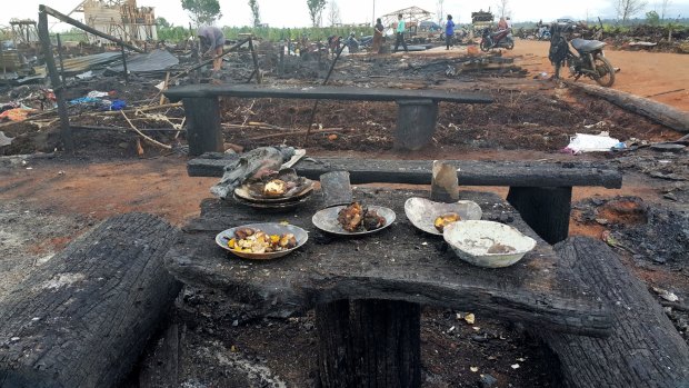 The charred remains of the Gafatar settlement burned down by a local mob.  