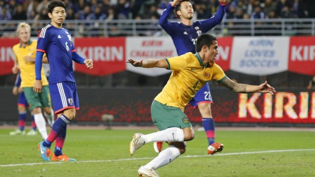 "We'll get there but we have to really concentrate on what's coming": Tim Cahill celebrates after scoring against Japan.